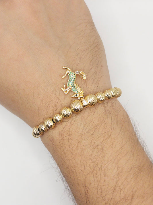 TEJIDA DIJE EQUINO VERDE ORO LAMINADO 18K