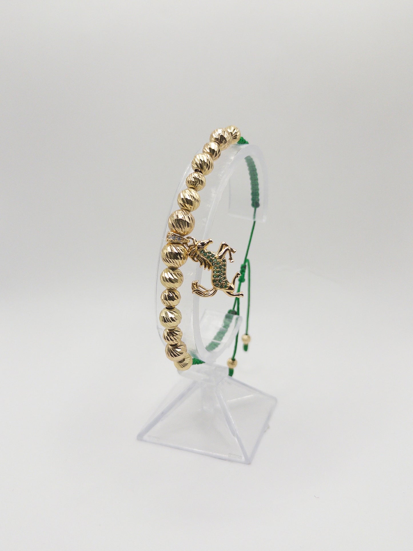 TEJIDA DIJE EQUINO VERDE ORO LAMINADO 18K