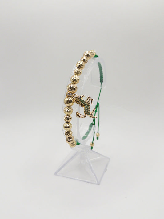 TEJIDA DIJE EQUINO VERDE ORO LAMINADO 18K