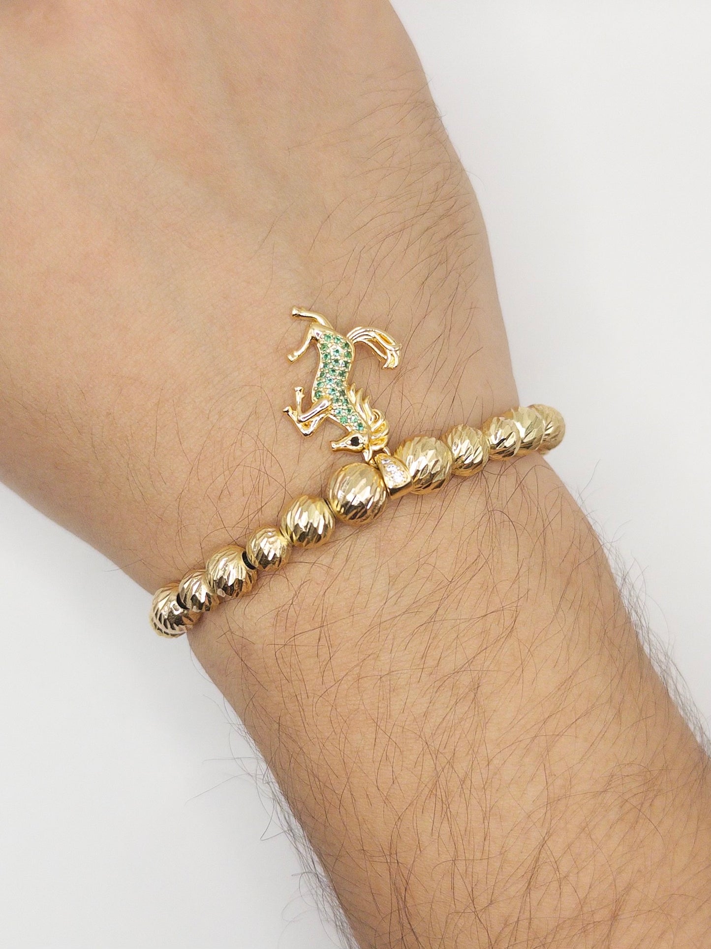 TEJIDA DIJE EQUINO VERDE ORO LAMINADO 18K